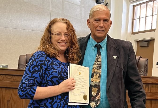 Okeechobee County Commissioners declared Feb. 19-25 as Engineers Week. Kelly Cranford (left) accepted the proclamation from Commission Chair David Hazellief.